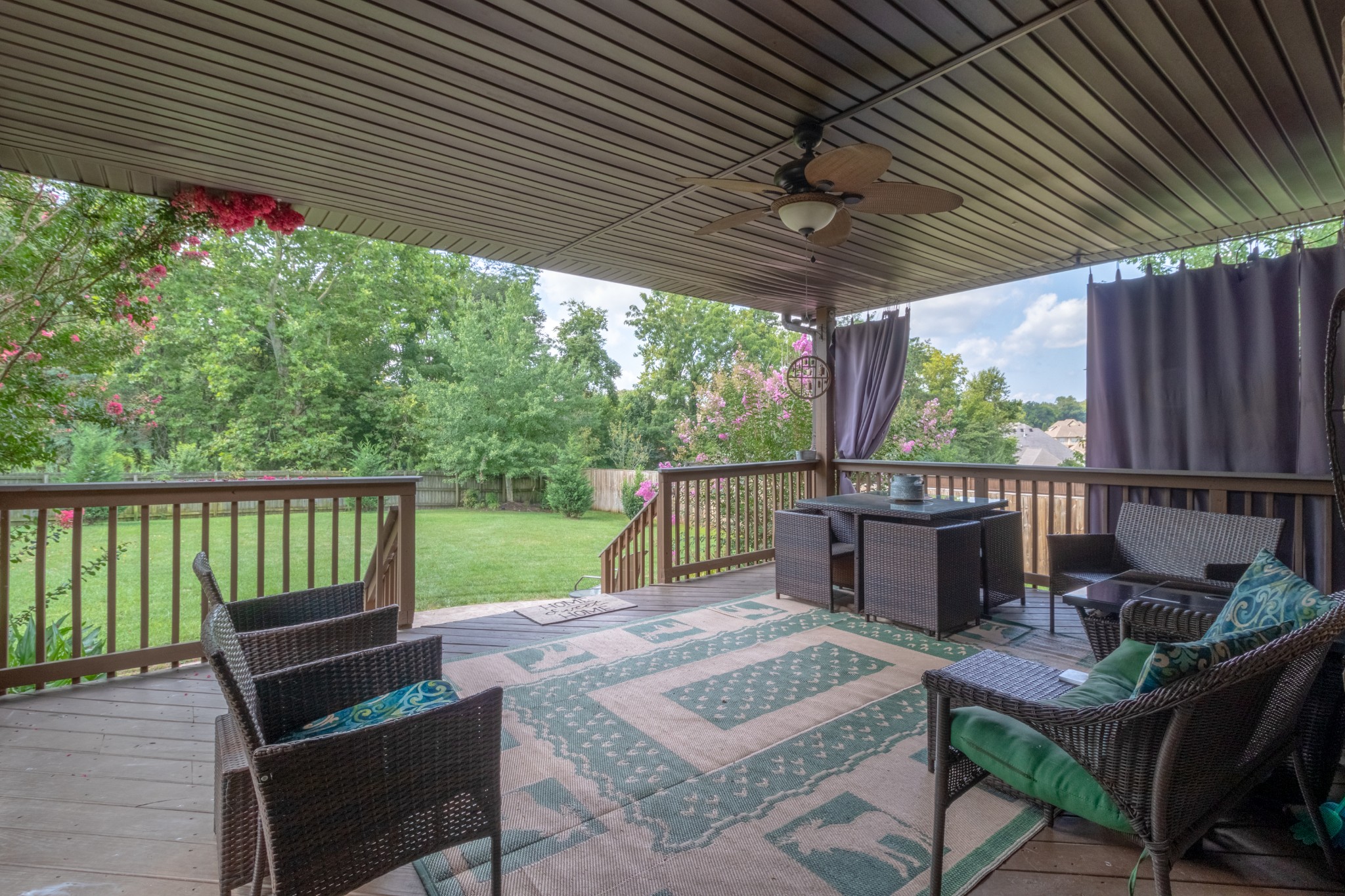 3592 Drake Road Adams, TN 37010 - Photo 42 of 47 a view of a patio with table and chairs with wooden floor and fence