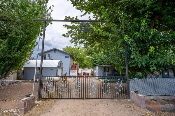 a view of a wrought iron fences in front of house