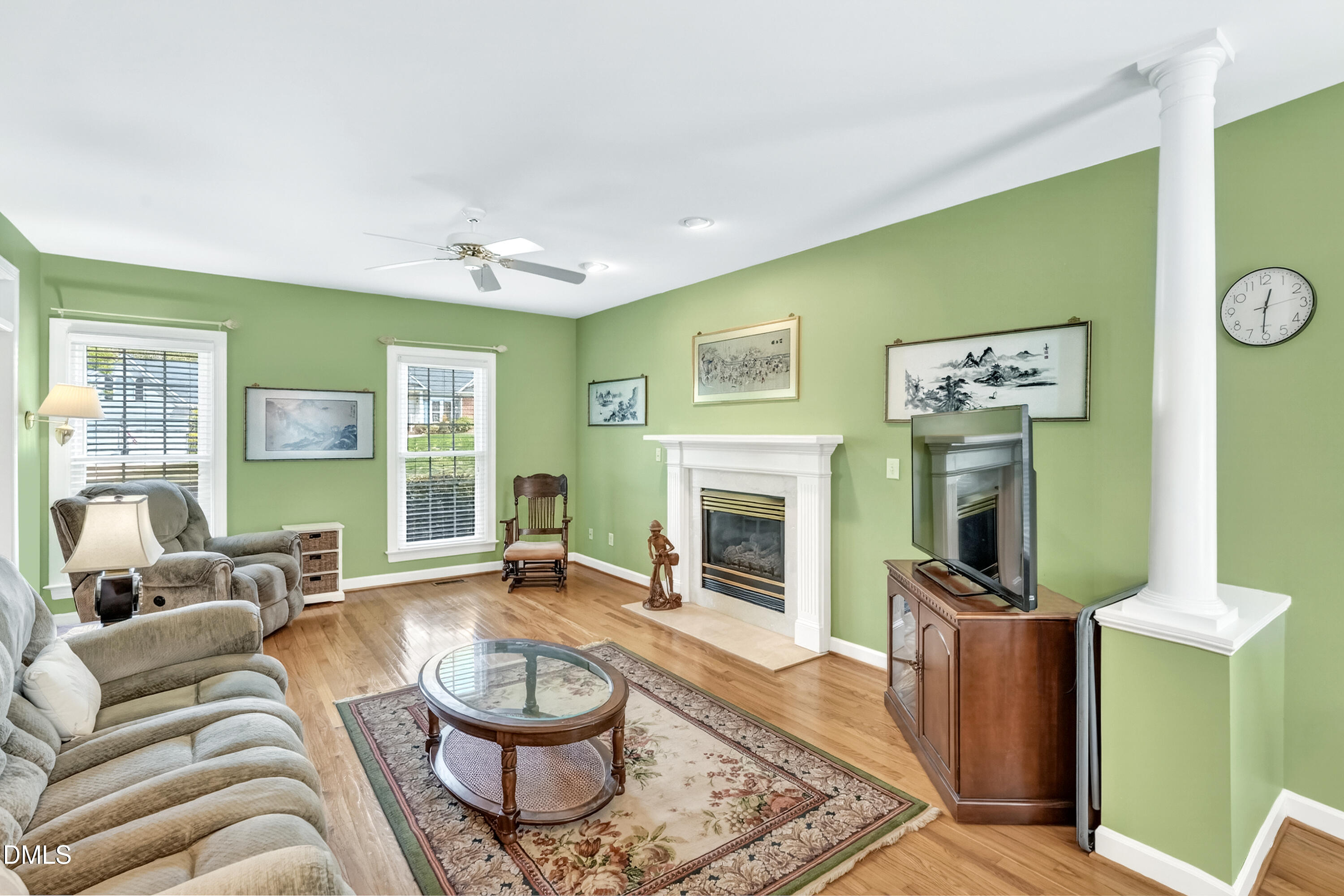 101 Sandy Hook Way Cary, NC 27513 - Photo 17 of 40 a living room with furniture a fireplace and a large window
