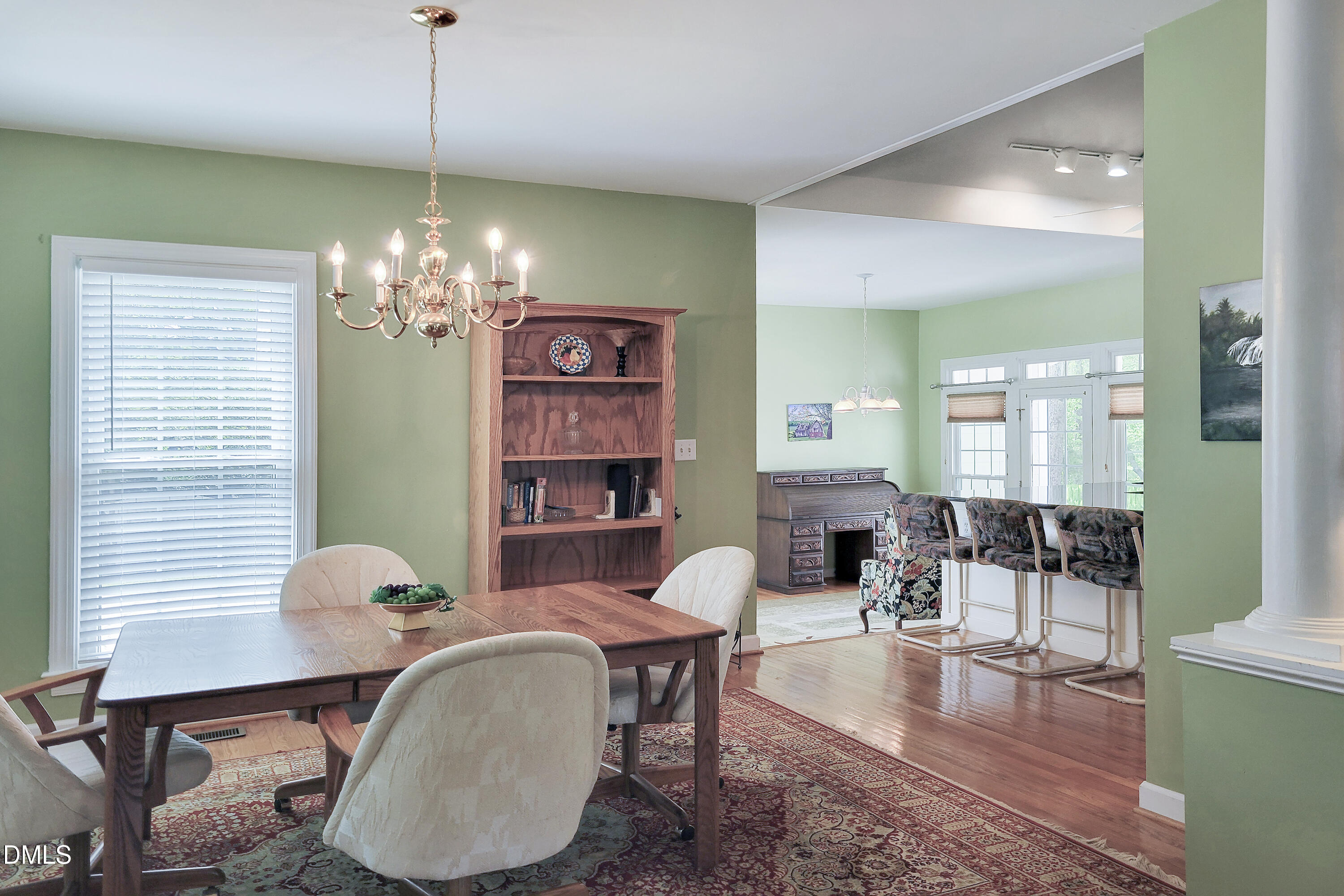 101 Sandy Hook Way Cary, NC 27513 - Photo 21 of 40 a dining room with furniture a chandelier and wooden floor