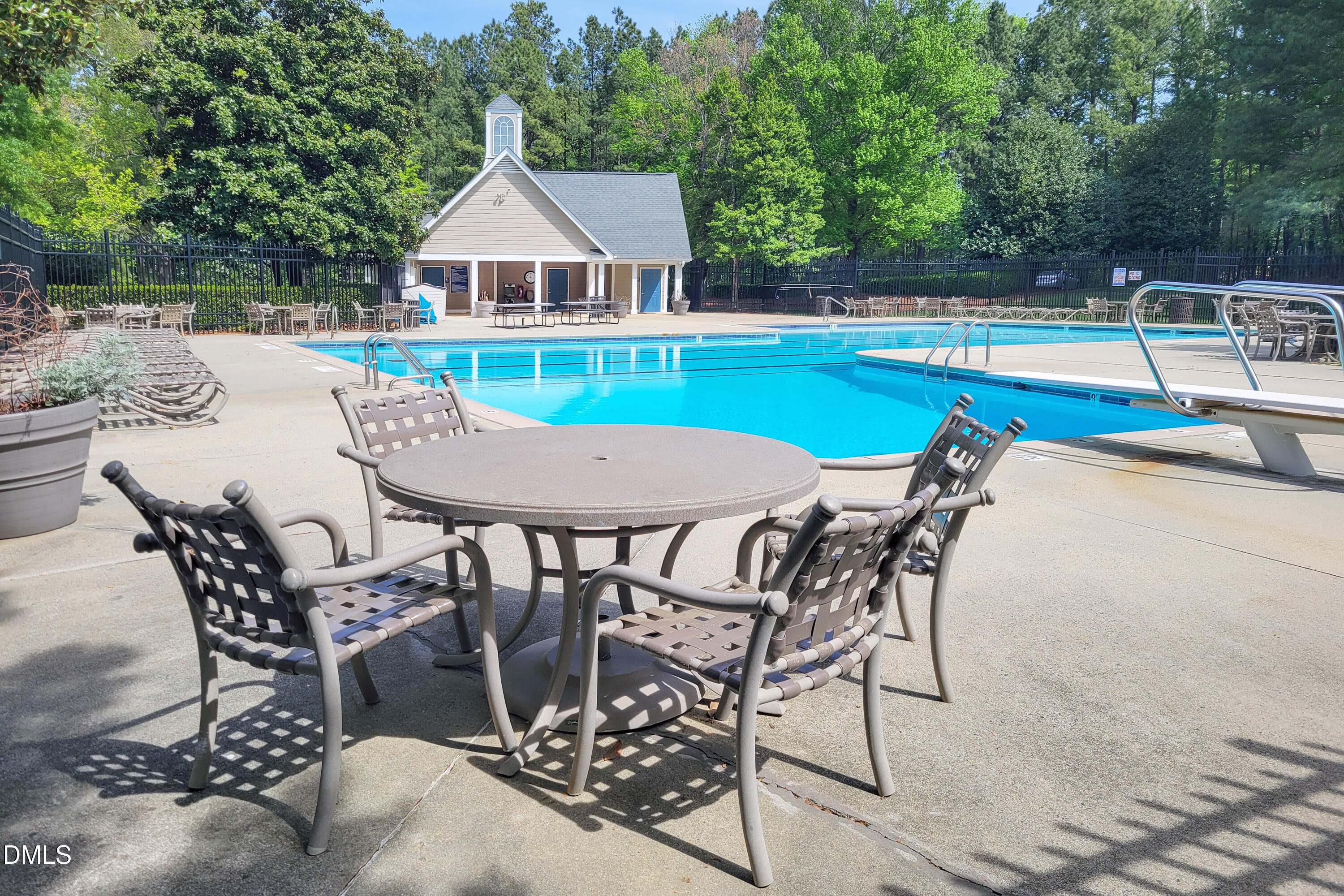 101 Sandy Hook Way Cary, NC 27513 - Photo 37 of 40 a view of a patio with table and chairs under an umbrella