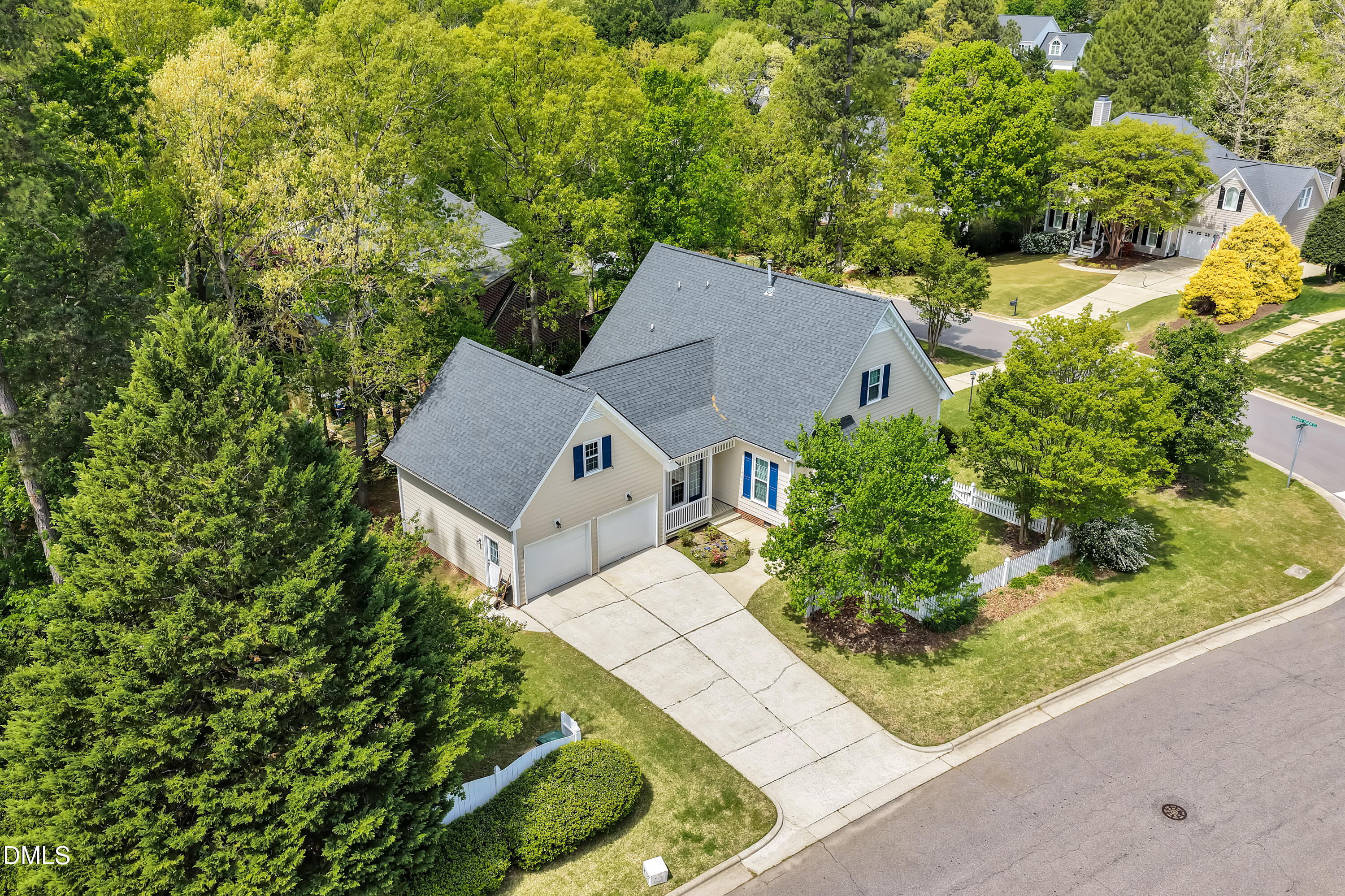 101 Sandy Hook Way Cary, NC 27513 - Photo 5 of 40 an aerial view of a house with a yard and trees all around