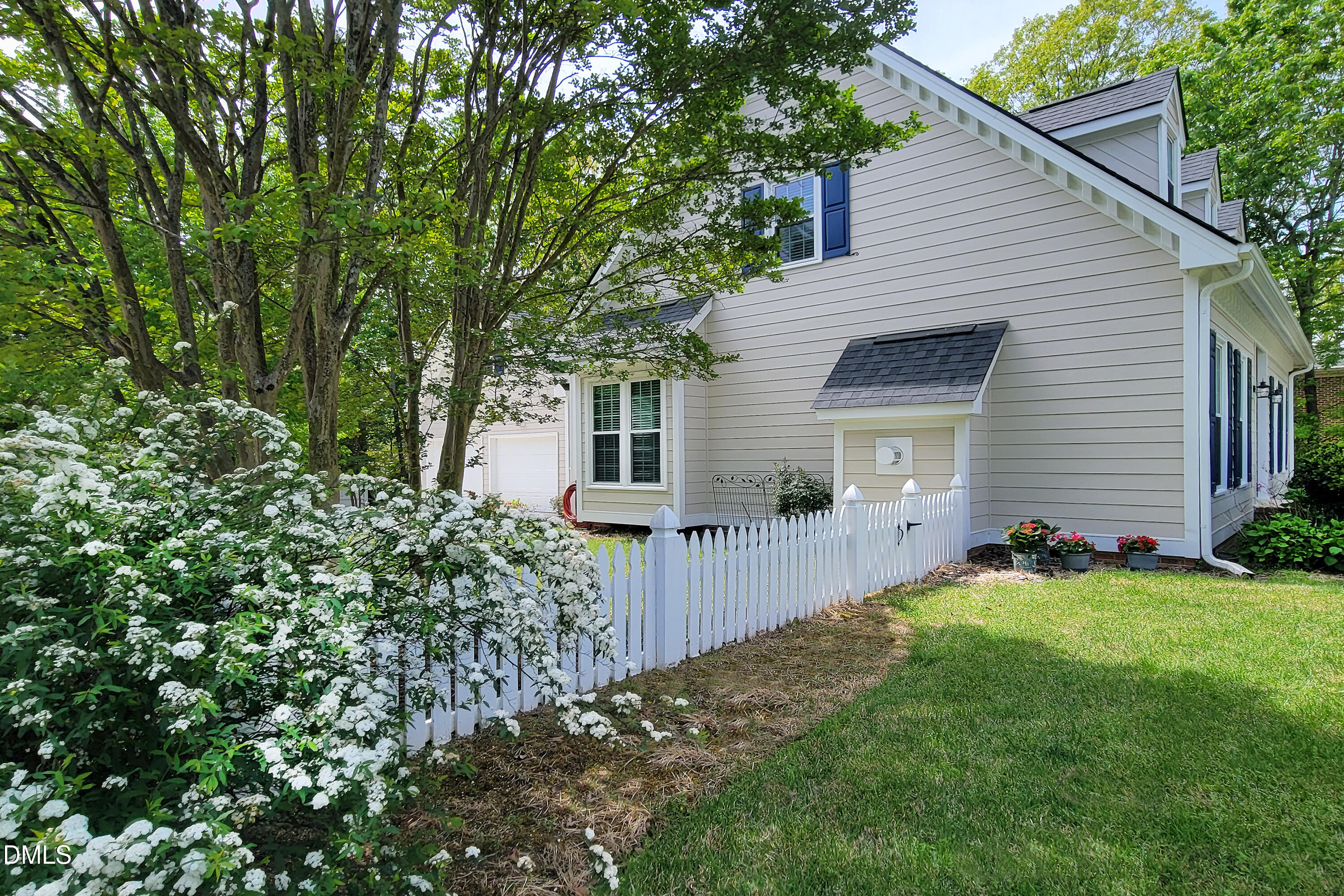 101 Sandy Hook Way Cary, NC 27513 - Photo 6 of 40 a front view of a house with a yard and garage