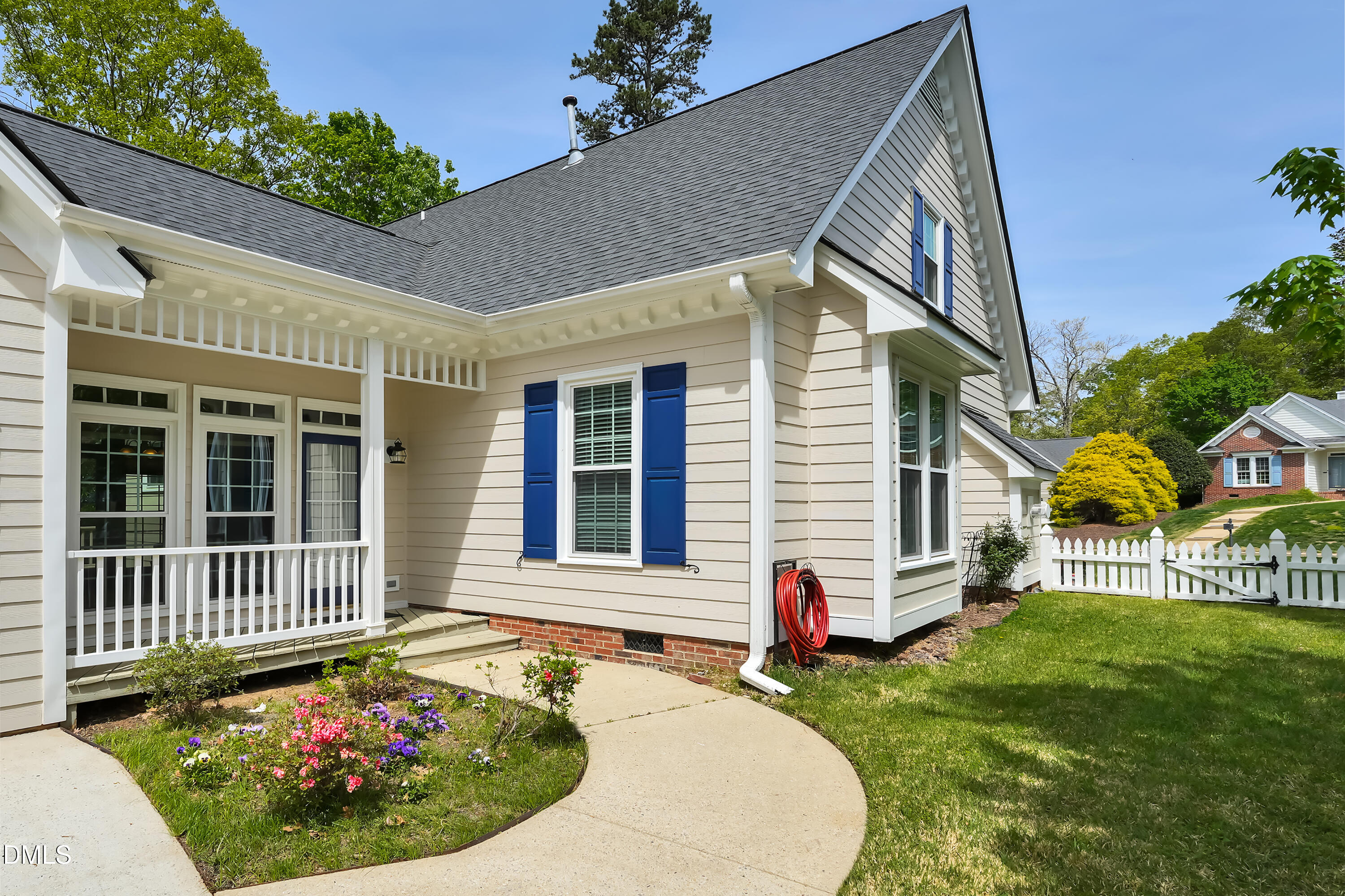 101 Sandy Hook Way Cary, NC 27513 - Photo 8 of 40 a view of a house with a small yard and a garden