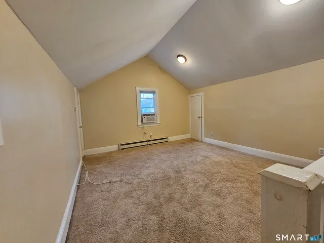 an empty room with a empty space and windows