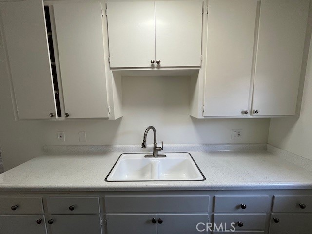 73740 Santa Rosa Way, Unit 5 Palm Desert, CA 92260 - Photo 9 of 20 a kitchen with a sink and cabinets