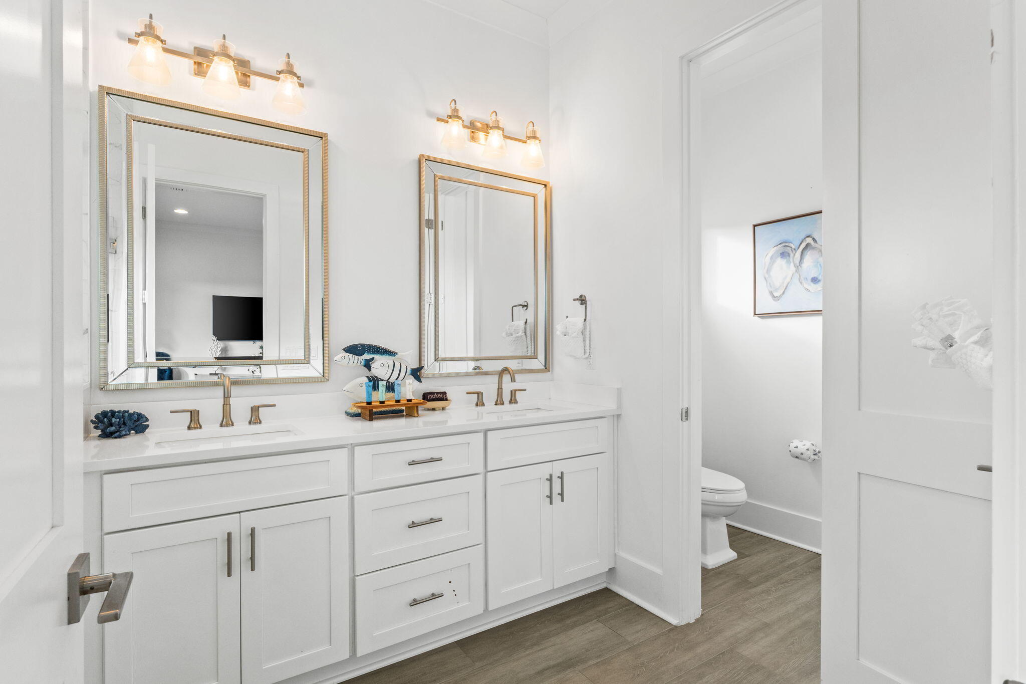 17 Penny Lane Santa Rosa Beach, FL 32459 - Photo 46 of 91 a bathroom with a double vanity sink a mirror and a toilet