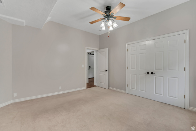 2154 Wasatch Boulevard Sandy, UT 84092 - Photo 41 of 55 Unfurnished bedroom featuring light colored carpet, a ceiling fan, and a closet