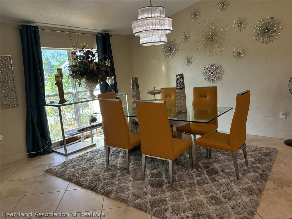 3800 Par Road Sebring, FL 33872 - Photo 9 of 33 a view of a dining room with furniture window and outside view