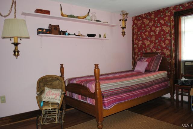 1209 Clearfield Road Nazareth, PA 18064 - Photo 12 of 22 a bedroom with a bed and a lamp on the dresser
