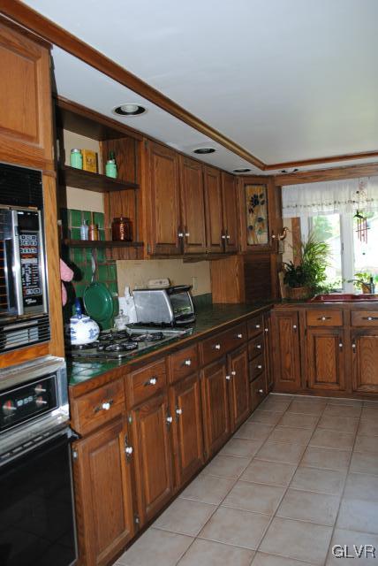 1209 Clearfield Road Nazareth, PA 18064 - Photo 2 of 22 a kitchen with stainless steel appliances granite countertop a stove a sink and a microwave