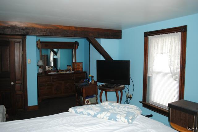 1209 Clearfield Road Nazareth, PA 18064 - Photo 10 of 22 a bedroom with a bed and a flat screen tv