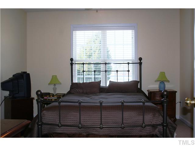 2111 Turtle Point Drive Raleigh, NC 27604 - Photo 12 of 21 Master bedroom is spacious with a great elevated view of the golf course. The large picture windows provides for great natural light.