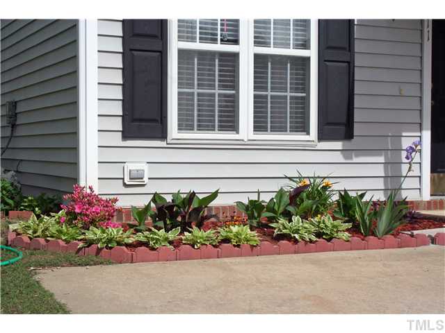 2111 Turtle Point Drive Raleigh, NC 27604 - Photo 2 of 21 The flowers are in bloom and the time is now to get into this adorable starter home!