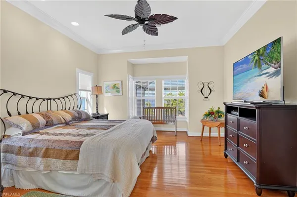 a bed room with a bed and a chandelier