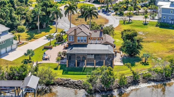 a front view of house with yard and swimming pool