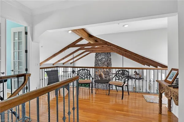 a view of staircase with a table and chairs