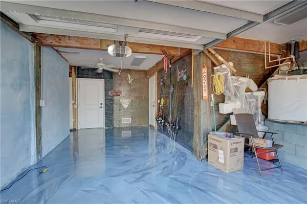 a view of hallway with wooden floor and furniture