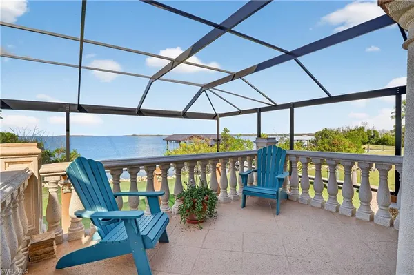 a view of a balcony with furniture