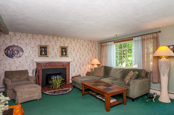 14 Carroll Road Woburn, MA 01801 - Photo 11 of 30 a living room with furniture and a fireplace