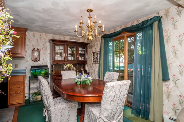 14 Carroll Road Woburn, MA 01801 - Photo 13 of 30 a view of a dining room with furniture and a chandelier