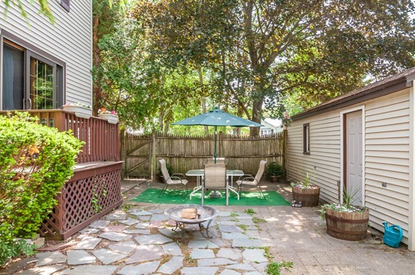 14 Carroll Road Woburn, MA 01801 - Photo 4 of 30 a view of a chair and table in backyard