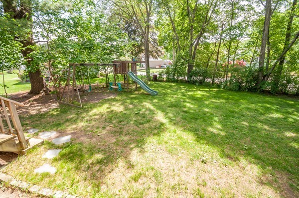 14 Carroll Road Woburn, MA 01801 - Photo 7 of 30 a backyard of a house with table and chairs