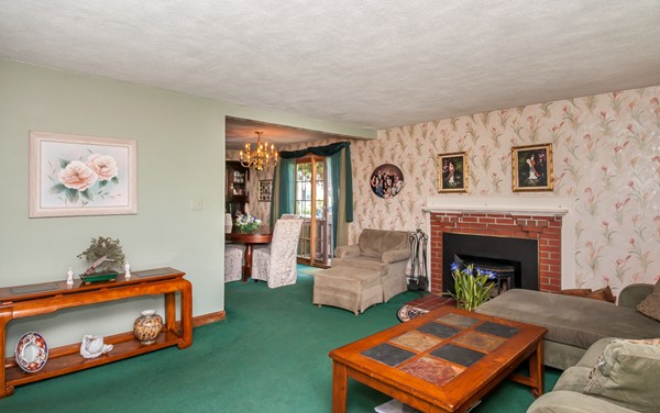 14 Carroll Road Woburn, MA 01801 - Photo 10 of 30 a living room with furniture and a fireplace