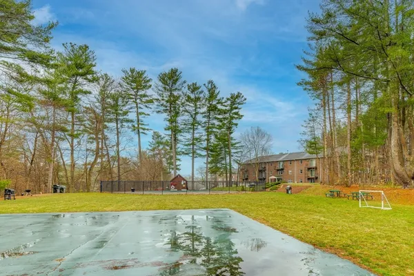 a backyard view of a house with swimming pool and sitting space