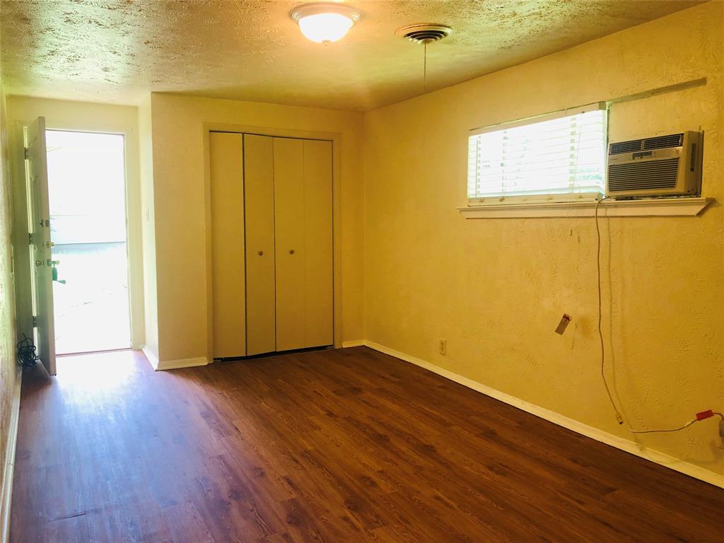 518 West Sycamore Street Denton, TX 76201 - Photo 2 of 11 a view of a hallway with wooden floor