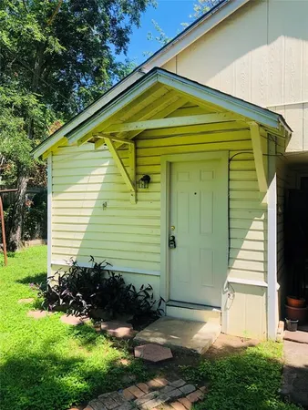 a view of a backyard with plants and a patio