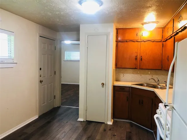 a view of a bathroom with a sink and a mirror