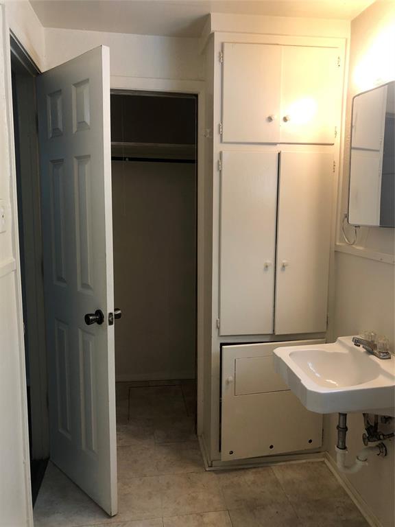 518 West Sycamore Street Denton, TX 76201 - Photo 10 of 11 a bathroom with a sink and a mirror