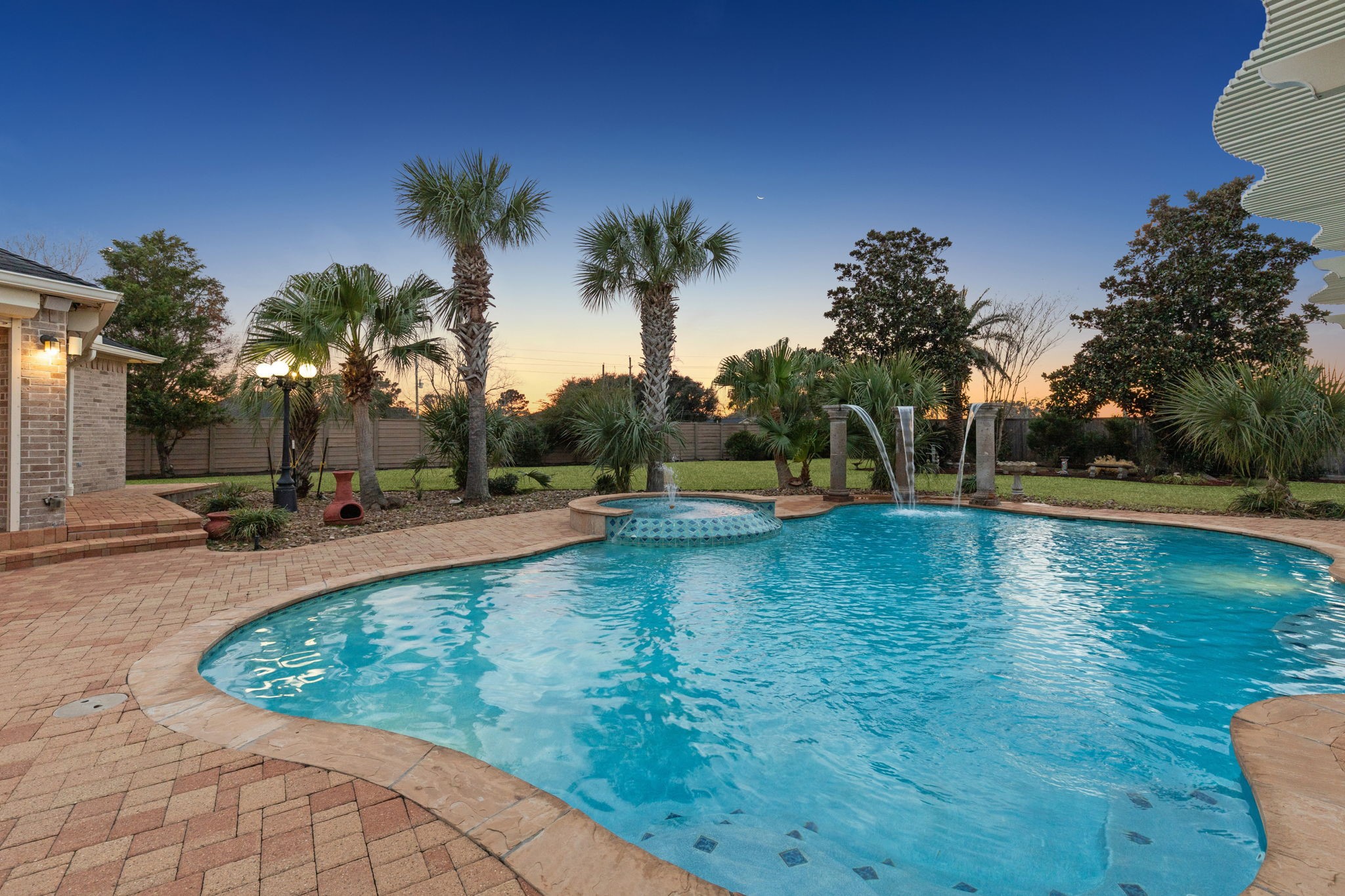 2202 Britton Ridge Drive Katy, TX 77494 - Photo 27 of 41 The in-ground salt water pool with Smart phone control is surrounded by an expansive patio offering plenty of room for lounging, sunbathing, and enjoying outdoor gatherings in style.