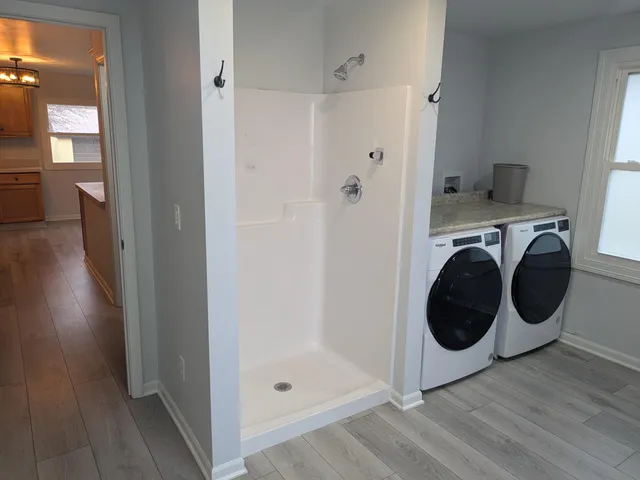 a view of a hallway with washer and dryer