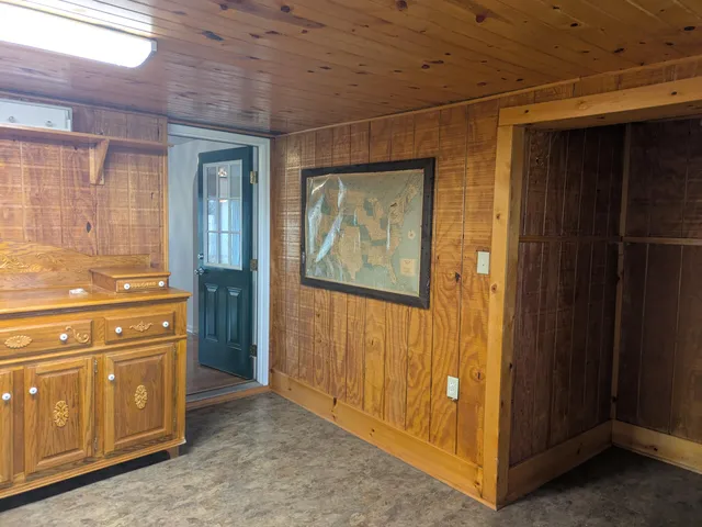 a view of an empty room with a fireplace