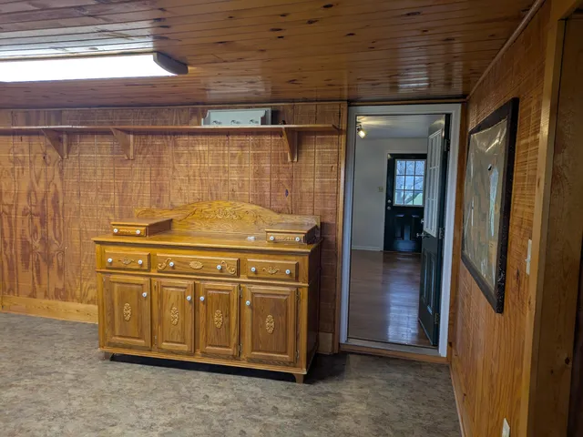 an empty room with a fireplace