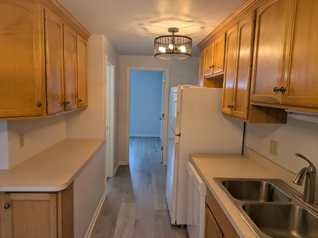 a kitchen with stainless steel appliances a refrigerator and a sink