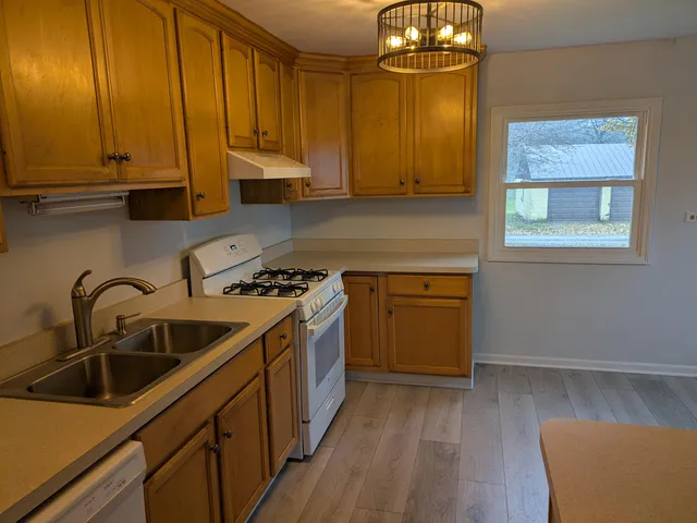a kitchen that has a sink and cabinets