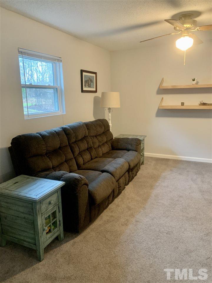 816 Patrick Road Bahama, NC 27503 - Photo 14 of 20 a living room with furniture and a window