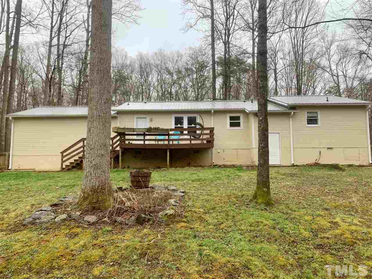 816 Patrick Road Bahama, NC 27503 - Photo 18 of 20 a front view of a house with a yard