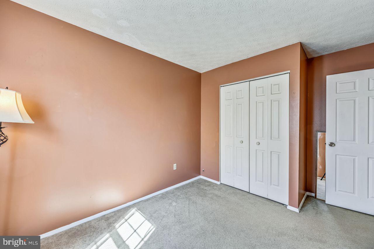 355 Rambling Ridge Court Pasadena, MD 21122 - Photo 17 of 28 a view of an empty room