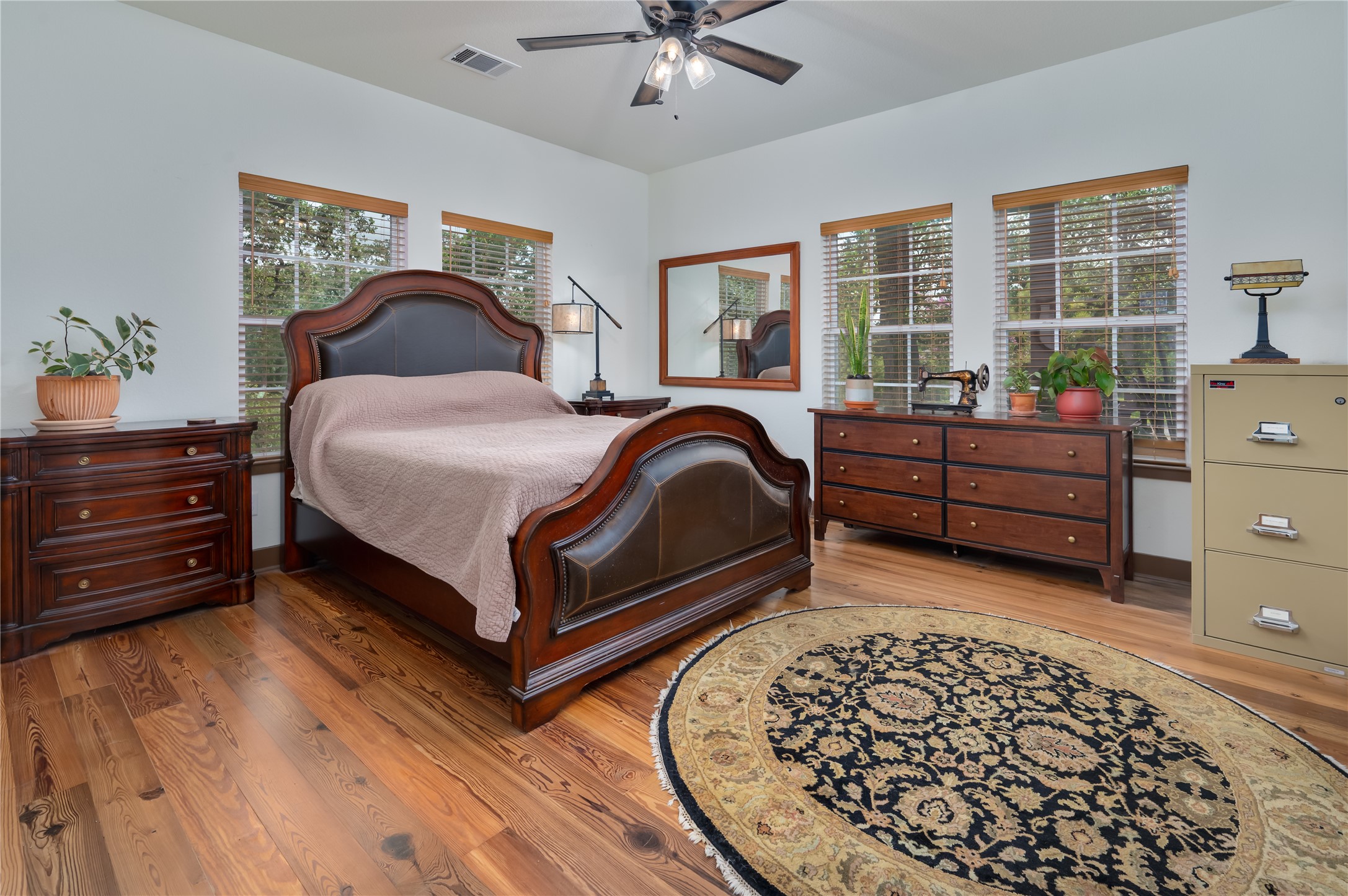 270 Dry Creek Road Manor, TX 78653 - Photo 19 of 40 Hardwood floors and bright windows complete this comfortable bedroom.