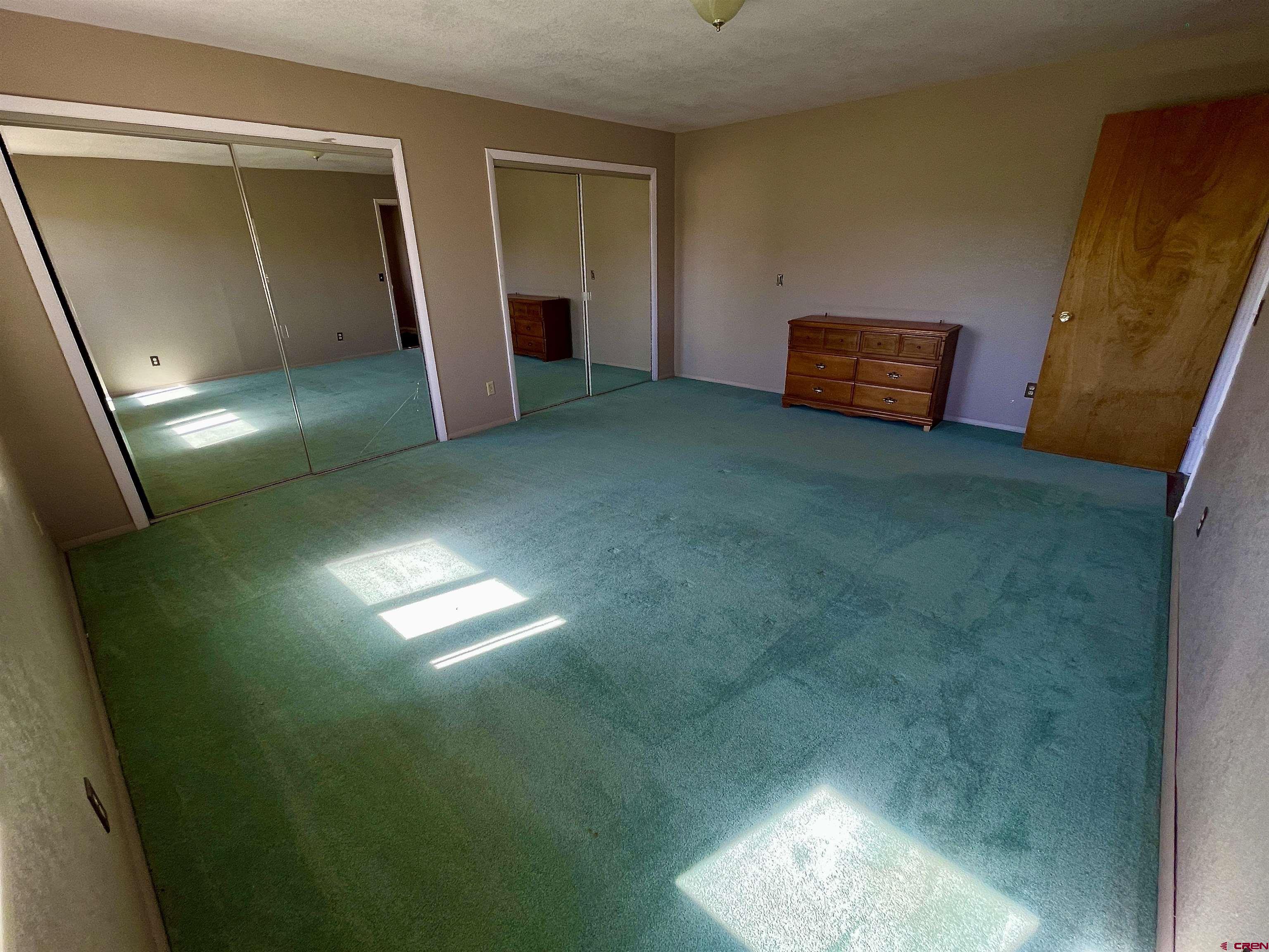 1733 B F Road Delta, CO 81416 - Photo 14 of 24 a room with furniture and a window