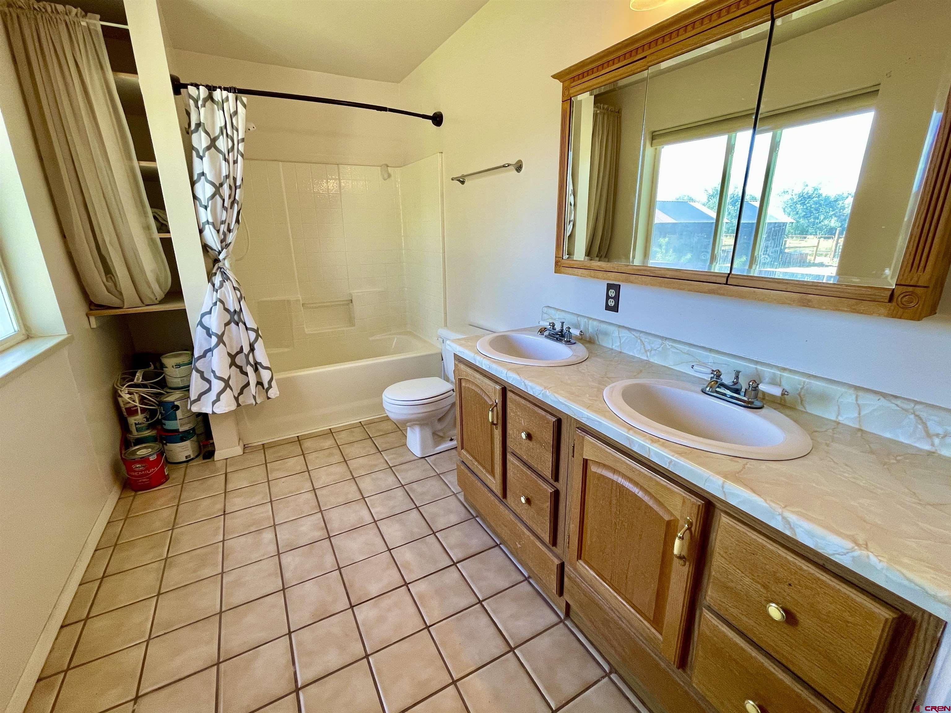 1733 B F Road Delta, CO 81416 - Photo 15 of 24 a bathroom with a sink a toilet and shower