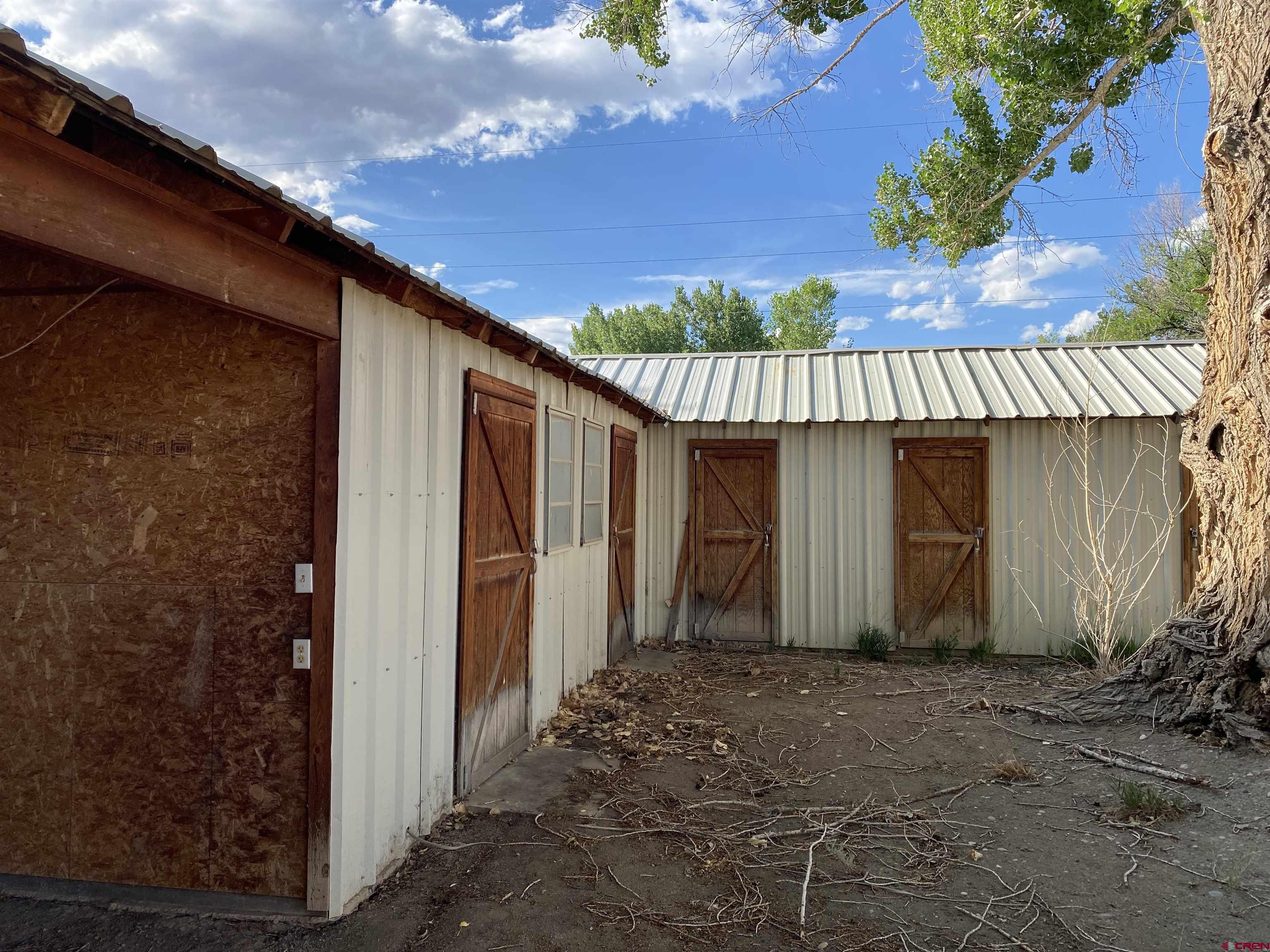 1733 B F Road Delta, CO 81416 - Photo 20 of 24 a view of a house with a backyard