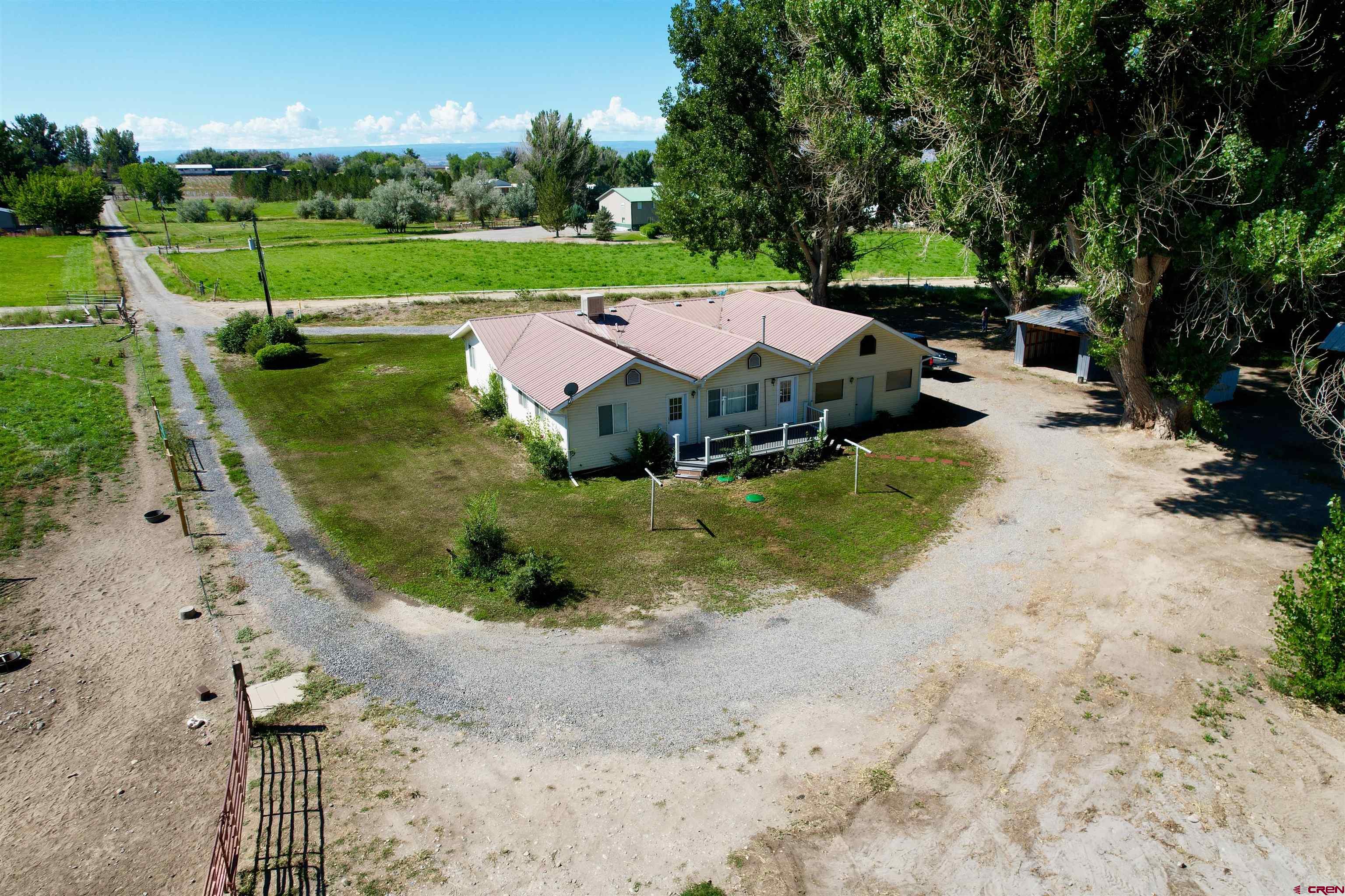 1733 B F Road Delta, CO 81416 - Photo 5 of 24 an aerial view of a house with outdoor space