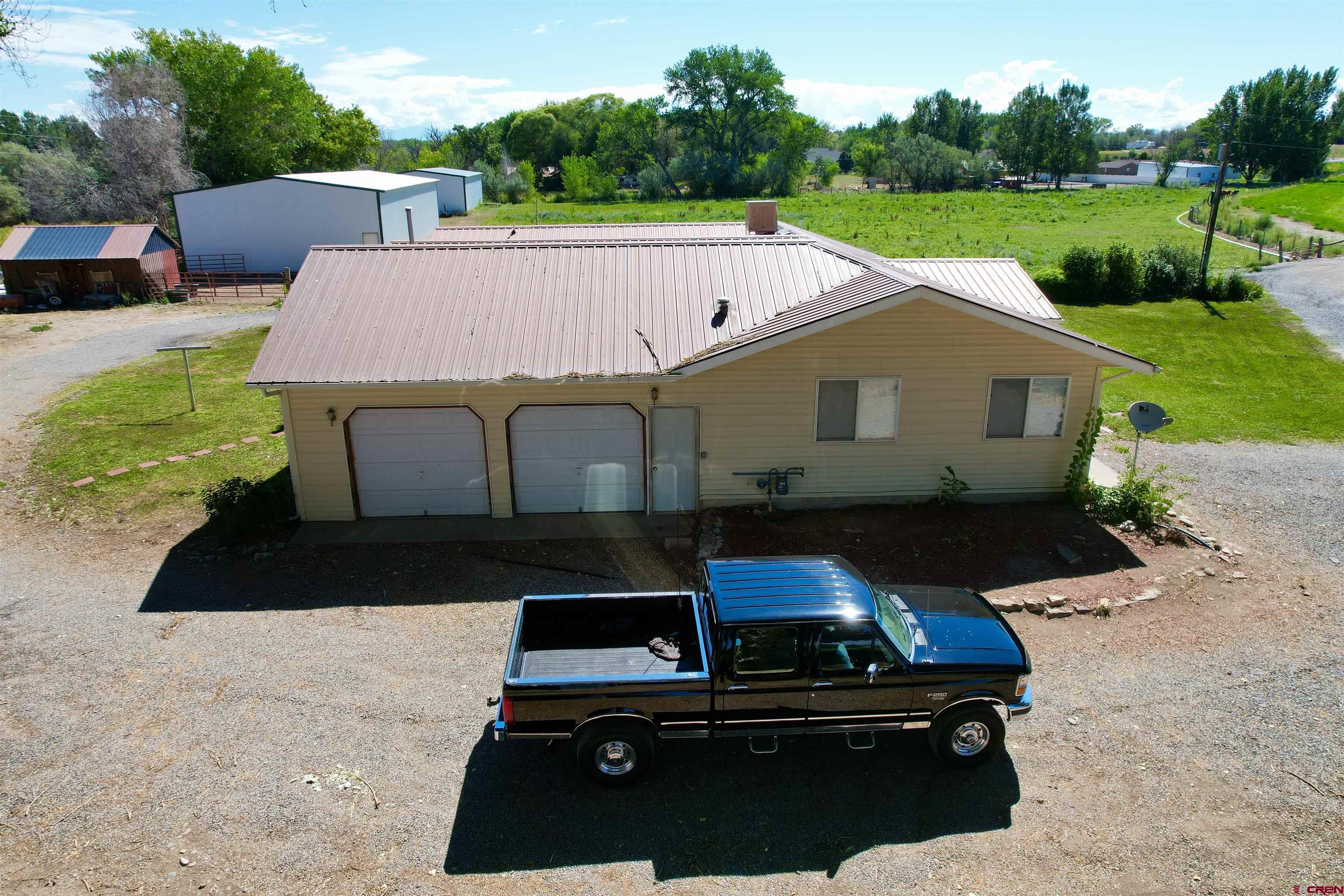 1733 B F Road Delta, CO 81416 - Photo 6 of 24 a aerial view of a house with a yard