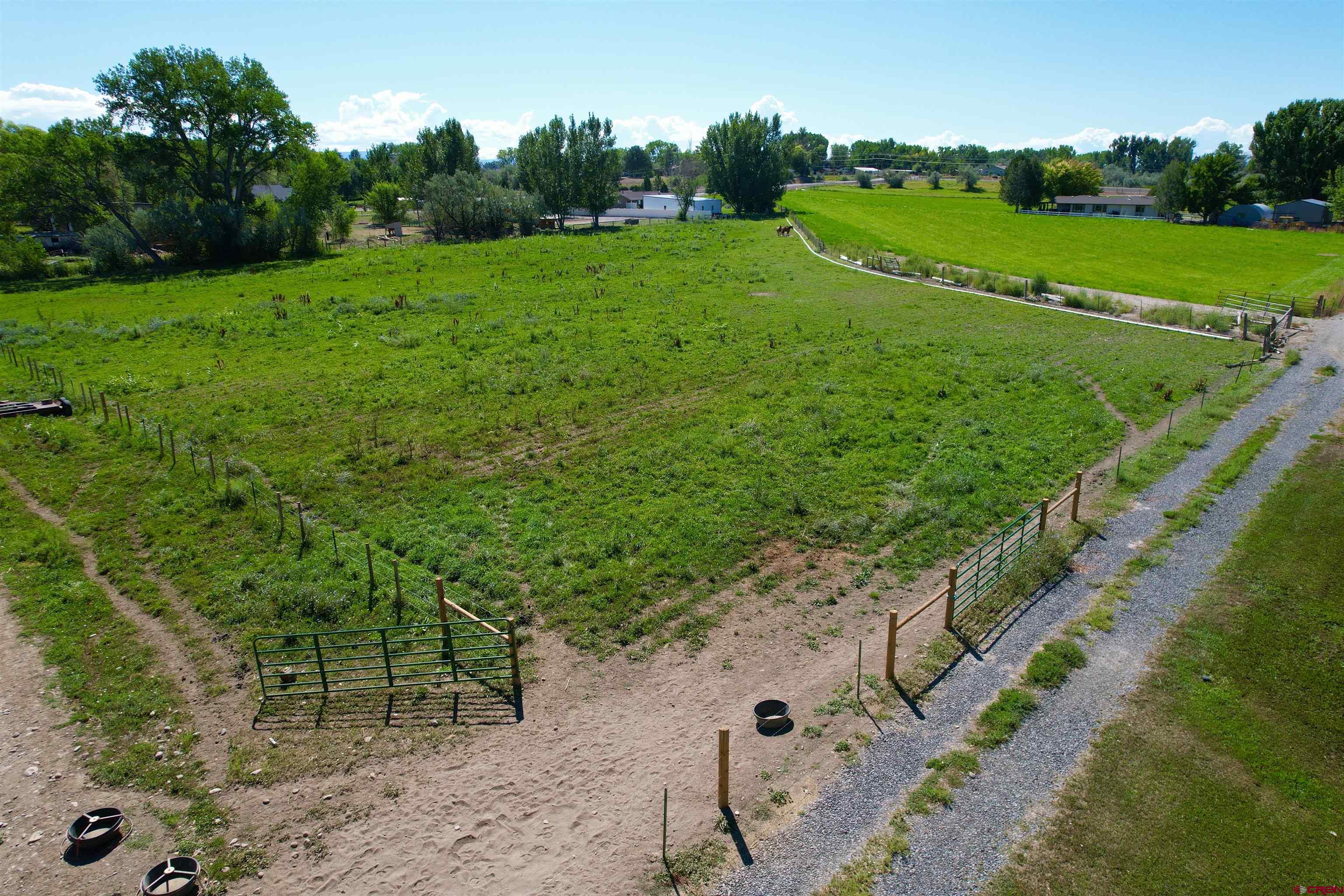 1733 B F Road Delta, CO 81416 - Photo 9 of 24 a view of a road with a yard