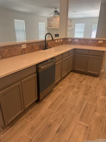 a spacious bathroom with a sink and a mirror